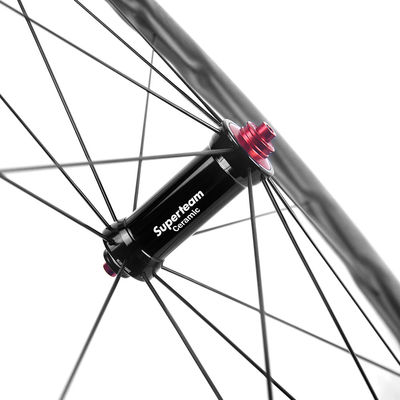 Kohlenstofffaser-Superteam-Straßenrad-Radensatz 25mm Breite 50mm Tiefe Keramiklagerknotenpunkte